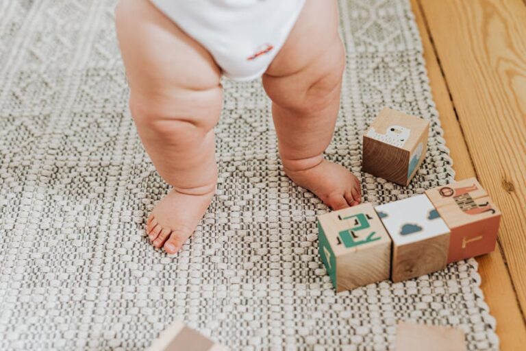 Capturing a baby's first steps with wooden building blocks on a soft indoor rug. Perfect for childhood memories.